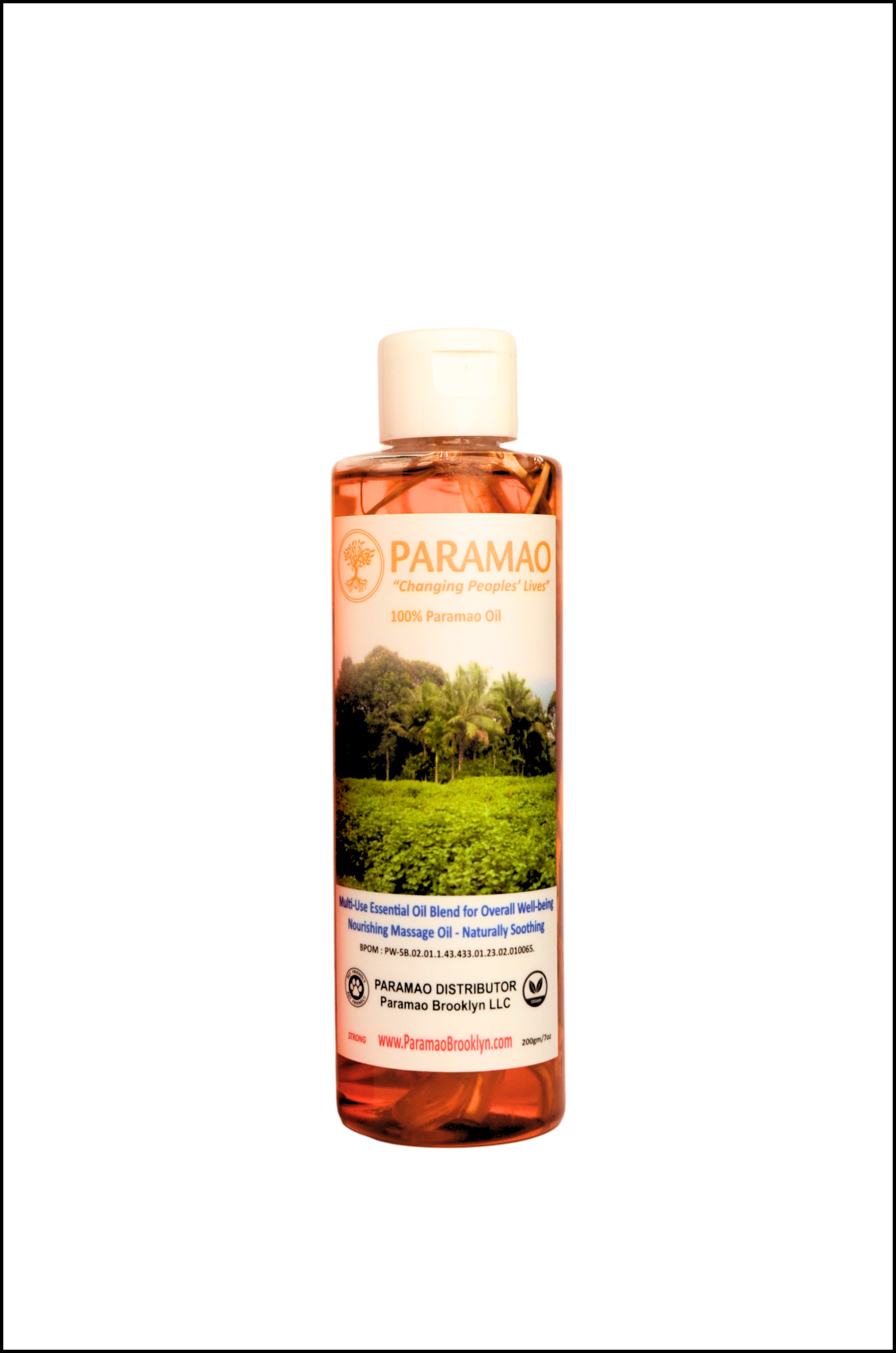 Bottle of 100% Pure Paramao oil with the root in the bottle, manufactured in Indonesia for over all wellness.